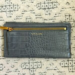 Brand new Love and Lore travel wallet.